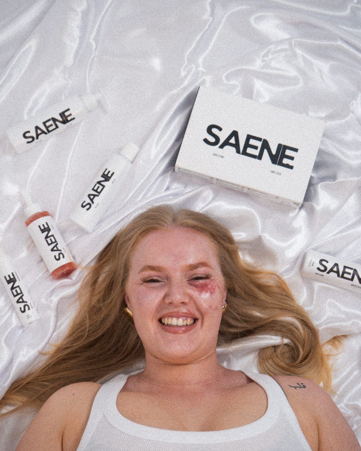 The Saene collection laid out around a smiling face